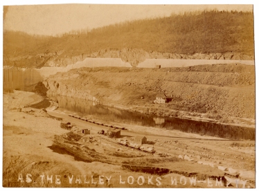 A rarely seen view of the area behind the dam during construction.