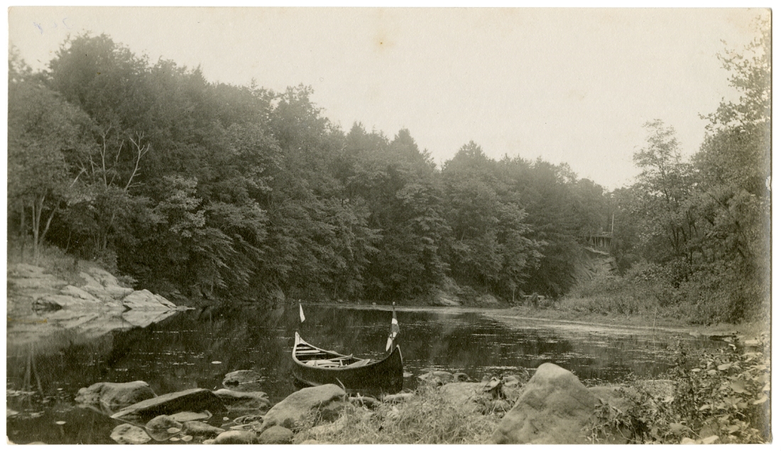 Canoe on the Croton River, south of the Nikko Inn. The Nikko can be seen on the cliff in the upper right. Courtesy of the Westchester County Historical Society.